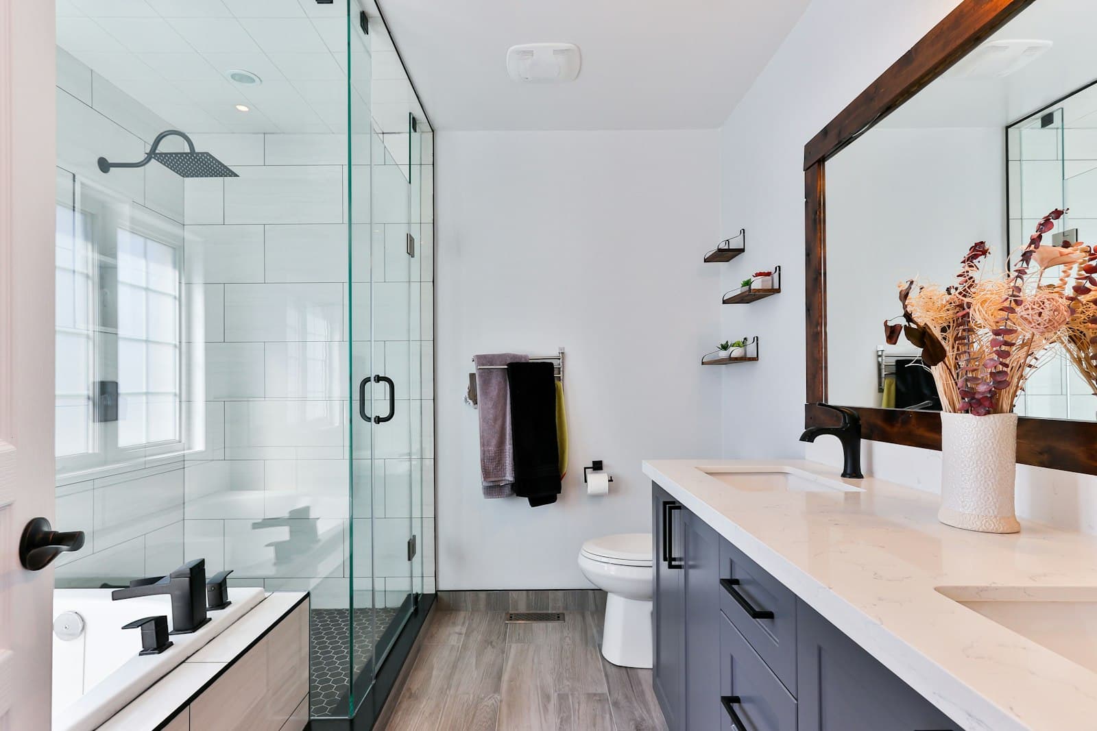 A renovated bathroom with a glass shower
